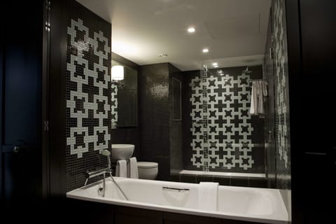 Designer toiletries, hair dryer, bathrobes, slippers