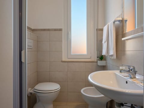 Family Quadruple Room, Balcony | Bathroom | Shower, free toiletries, bidet, towels