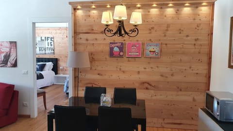 Panoramic Apartment, Balcony, Mountain View | Living area | Flat-screen TV