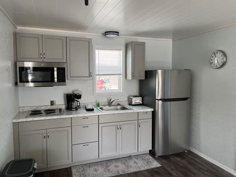 Fridge, microwave, stovetop, coffee/tea maker