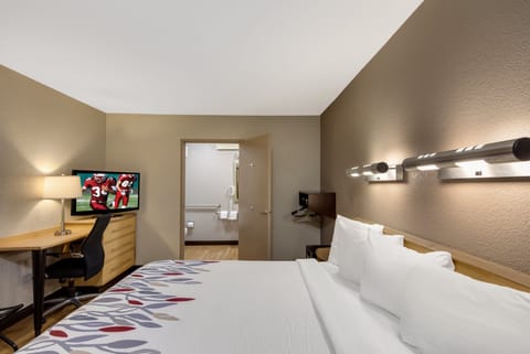 Desk, laptop workspace, blackout drapes, iron/ironing board