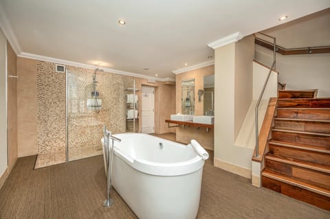 Decadent | Bathroom | Separate tub and shower, deep soaking tub, rainfall showerhead