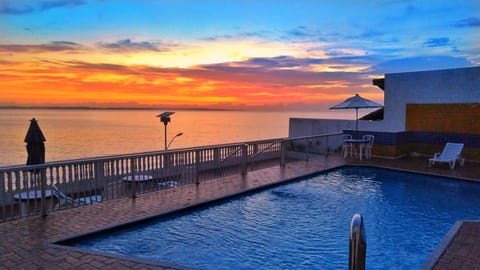 Outdoor pool, open 9 AM to 9 PM, pool umbrellas, sun loungers