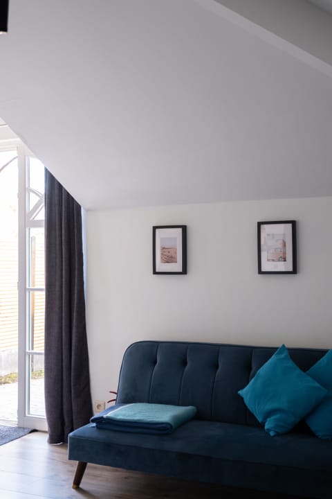 Junior Triple Room | Living area | Flat-screen TV