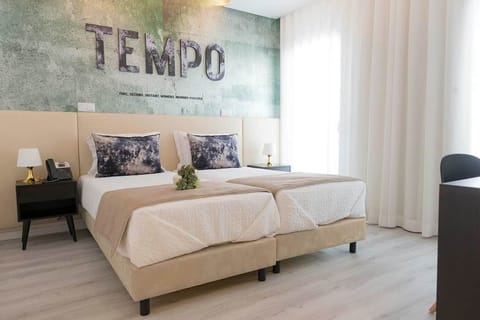 Double or Twin Room | Minibar, in-room safe, individually decorated, desk