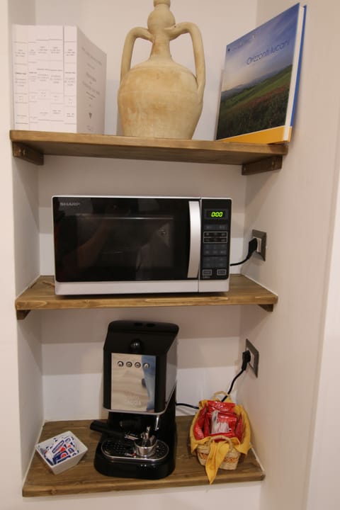 Full-size fridge, stovetop, espresso maker, coffee/tea maker