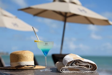 On the beach, white sand, sun loungers, beach umbrellas