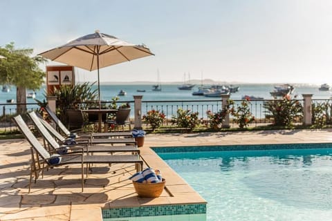 Indoor pool, outdoor pool, open 9:00 AM to 10:00 PM, pool umbrellas