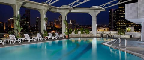 Outdoor pool, open 7:00 AM to 10:00 PM, pool umbrellas, sun loungers