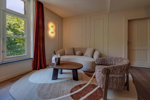 Suite, Park View, Garden Area | Living area | Flat-screen TV