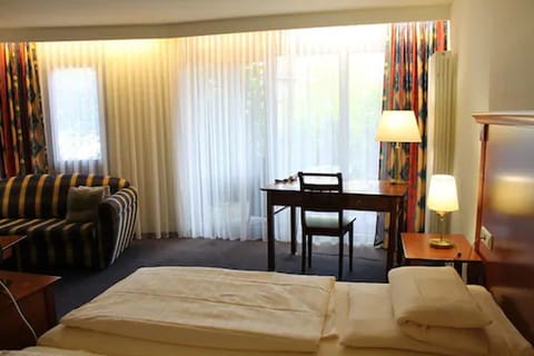 Junior Double Room | Living area | 40-inch flat-screen TV with satellite channels, TV
