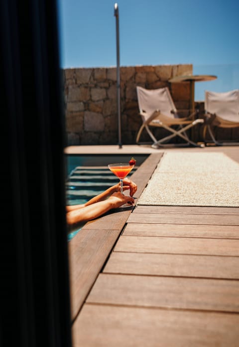 Seasonal outdoor pool, open 8:30 AM to 6:30 PM, pool umbrellas