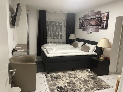 Family Studio, 2 Bedrooms | Living area | TV