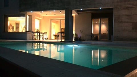 Outdoor pool, an infinity pool, sun loungers