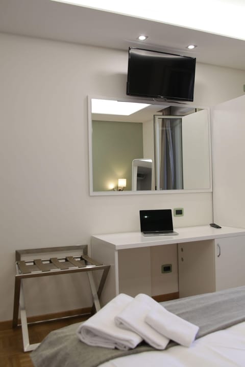 Double or Twin Room | Minibar, in-room safe, desk, rollaway beds