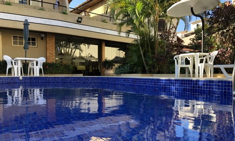 Outdoor pool, open 9 AM to 8 PM, pool umbrellas, sun loungers