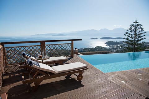 Seasonal outdoor pool, an infinity pool, sun loungers