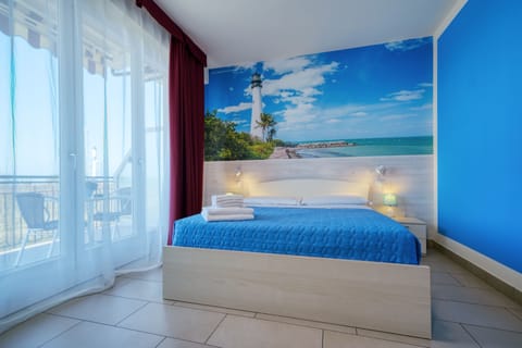 Double Room, Balcony, Partial Lake View | Minibar, in-room safe, individually decorated, desk