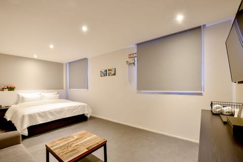 VIP | Desk, blackout drapes, iron/ironing board, bed sheets