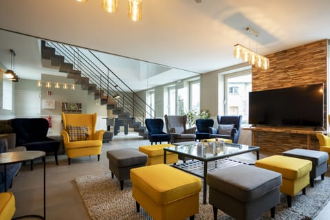 Group accommodation at the Koppenberg with Sauna and Tree House | Living area | Flat-screen TV