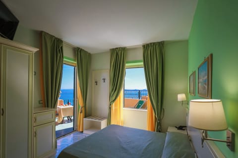 Double Room, Terrace, Sea View | Minibar, in-room safe, desk, laptop workspace