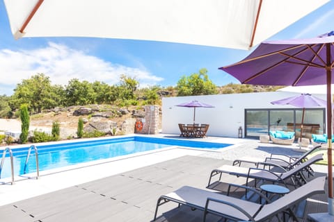 Seasonal outdoor pool, open 9:00 AM to 8:00 PM, sun loungers