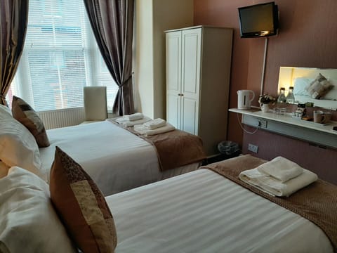 Family Triple Room | Individually decorated, individually furnished, desk, blackout drapes