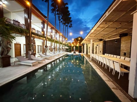 Outdoor pool, open 7 AM to 9 PM, pool umbrellas, sun loungers