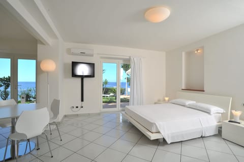 Junior Suite (4 Adults) | 1 bedroom, premium bedding, minibar, in-room safe