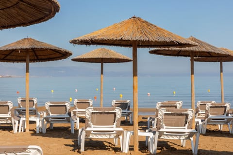 On the beach, sun loungers, beach umbrellas, beach towels