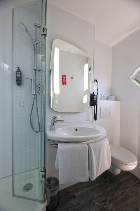 Shower, eco-friendly toiletries, hair dryer, towels