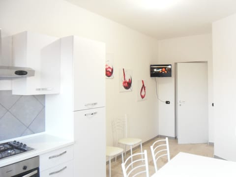 Fridge, electric kettle, cleaning supplies, freezer