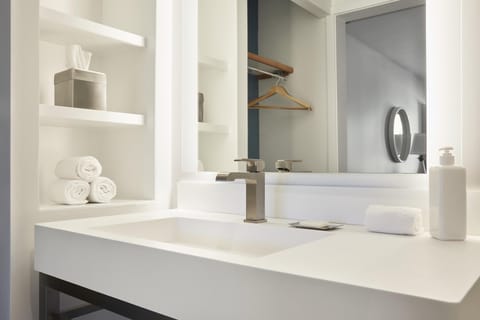 Combined shower/tub, designer toiletries, hair dryer, towels