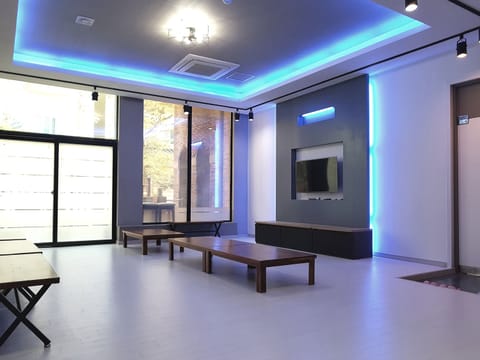 Room, 3 Bedrooms (Sunflower) | Living area | 50-inch flat-screen TV with cable channels, TV
