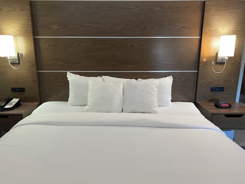 Desk, laptop workspace, blackout drapes, iron/ironing board