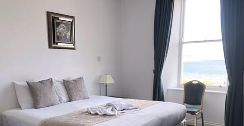 Double Room, Sea View | Blackout drapes, iron/ironing board, free WiFi, bed sheets