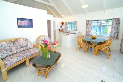 Comfort Bungalow, 1 Bedroom, Garden Area | Living room | Flat-screen TV, DVD player