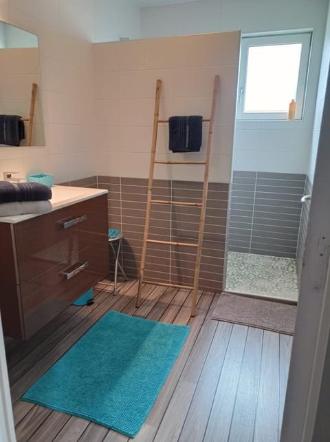 Shower, rainfall showerhead, hair dryer, towels