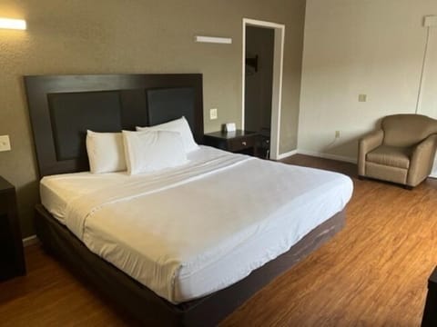 Desk, laptop workspace, bed sheets