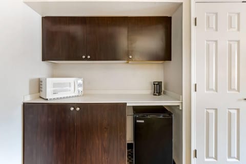 Premium bedding, desk, laptop workspace, iron/ironing board