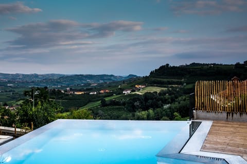 Seasonal outdoor pool, open 9:00 AM to 7:00 PM, pool umbrellas