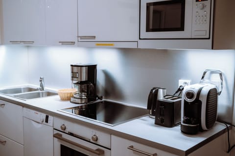 Golden Circle Suite with Kitchen & Sauna | Private kitchen | Full-size fridge, microwave, oven, stovetop