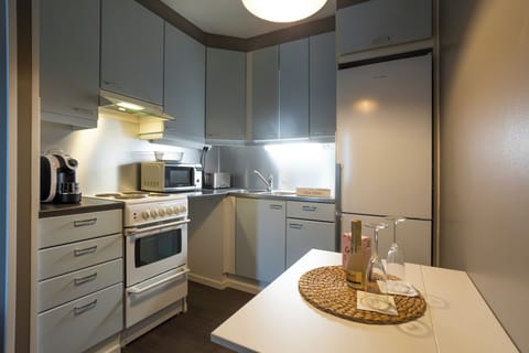 Superior Suite with Kitchen & Sauna | Private kitchen | Full-size fridge, microwave, oven, stovetop