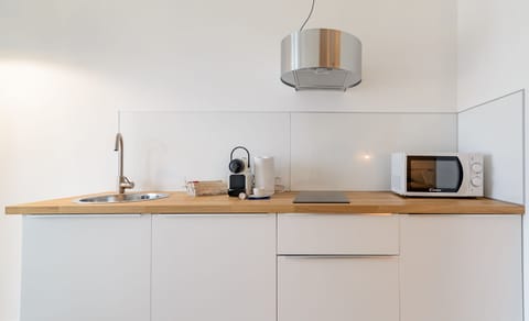 Comfort Apartment (Maestrale) | Private kitchen | Fridge, microwave, stovetop, coffee/tea maker