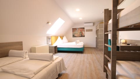 Family Room | Hypo-allergenic bedding, minibar, in-room safe, desk