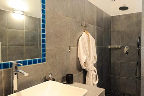 Shower, designer toiletries, hair dryer, bathrobes