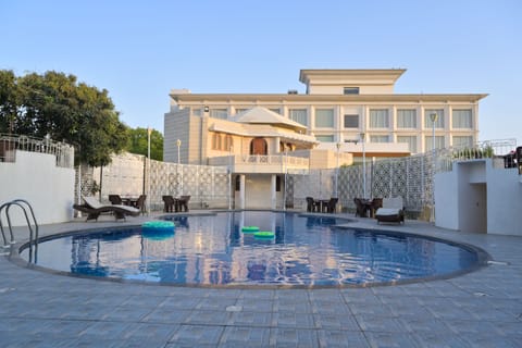 Outdoor pool, open 7:00 AM to 7:00 PM, free cabanas, pool umbrellas