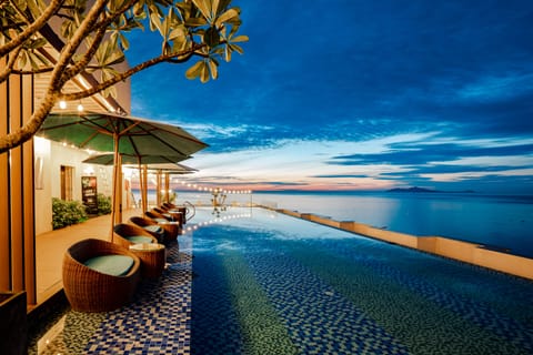 Outdoor pool, open 6 AM to 10:00 PM, pool umbrellas, sun loungers