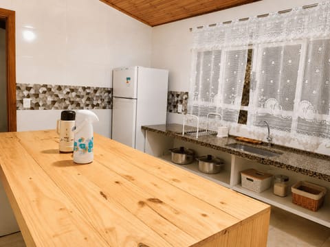 Full-size fridge, oven, stovetop, cookware/dishes/utensils