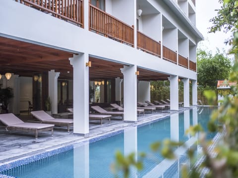 Indoor pool, open 7 AM to 9 PM, pool umbrellas, sun loungers